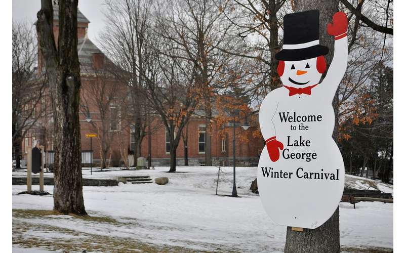 lake george winter carnival snowman sign