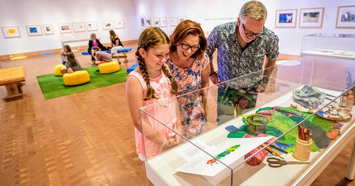 kid with her parents at Eric Carle Museum