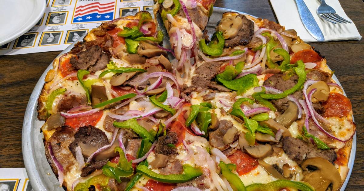 pizza with peppers, onions, mushrooms, etc.