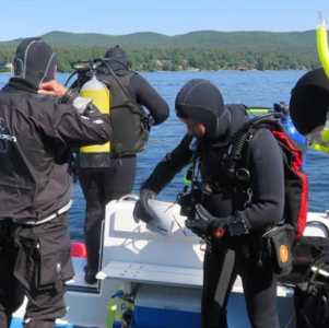scuba divers on a boat
