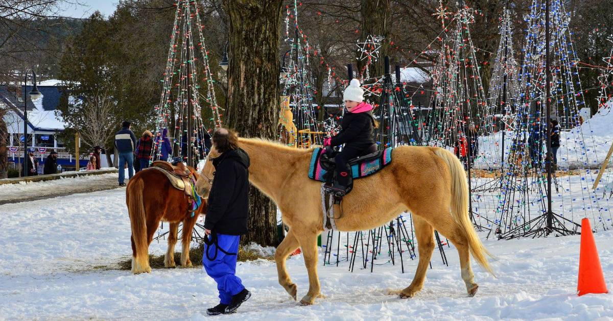 kid on pony at winter carnival