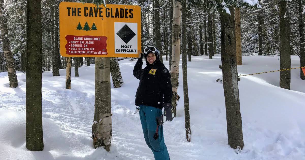 cave glades sign with guy
