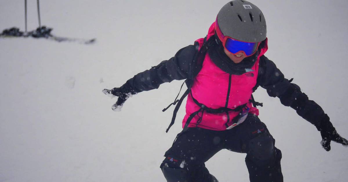 kid snowboarder in pink