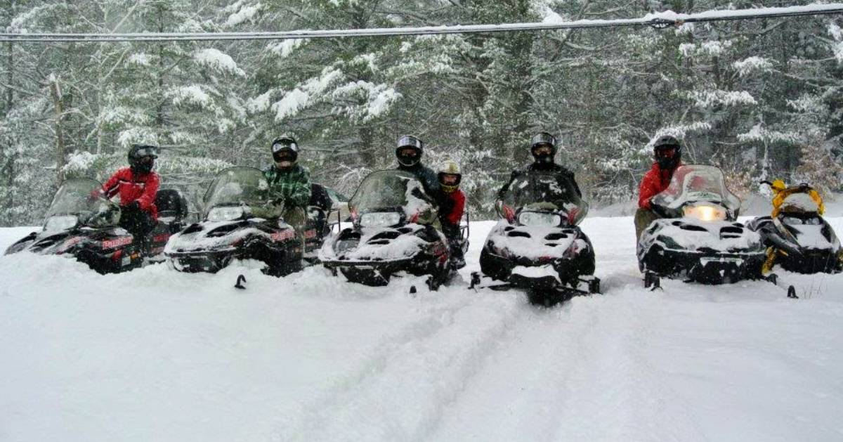 snowmobilers lined up next to each other