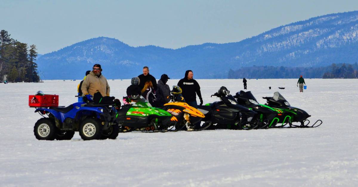 snowmobilers on frozen lake