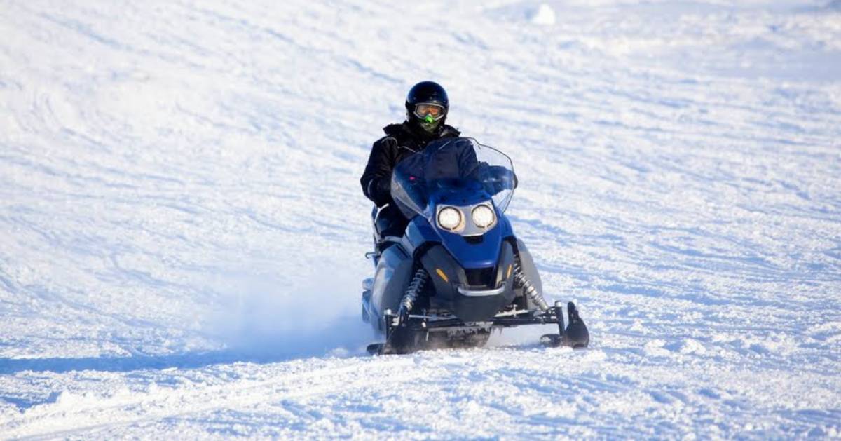 guy snowmobiling