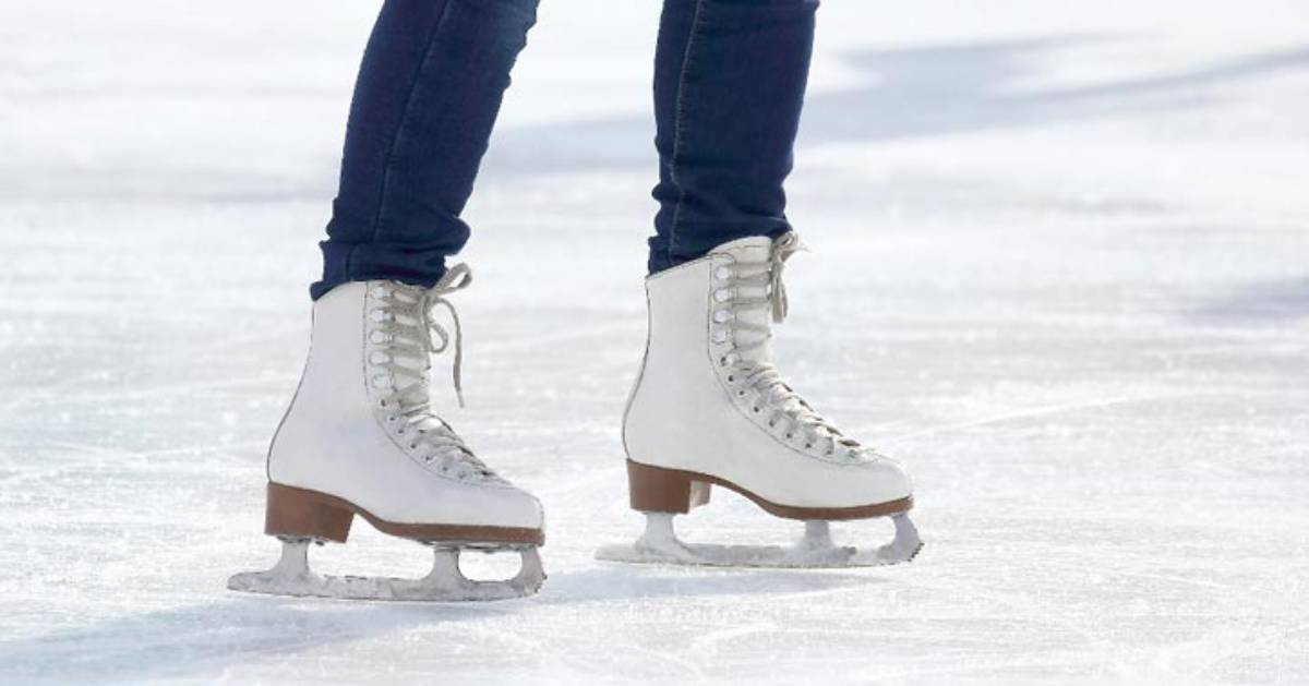 a person wearing white ice skates