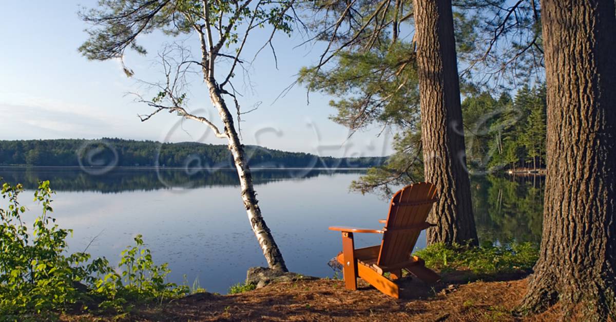 Adirondack chair by lake
