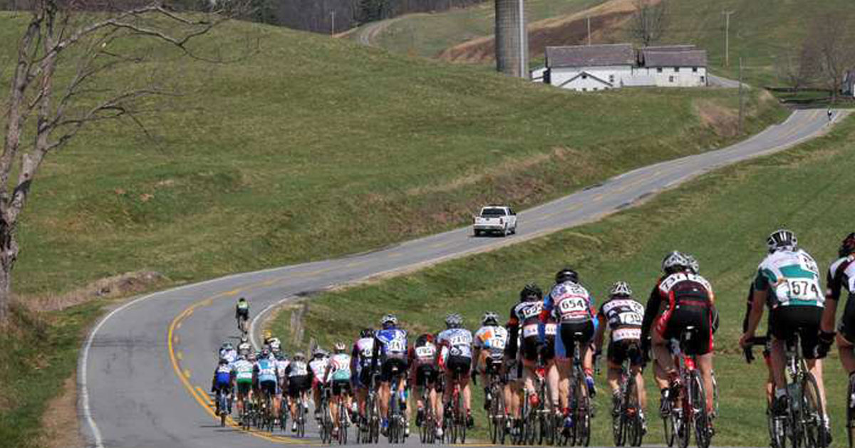 biking tour going down a country road