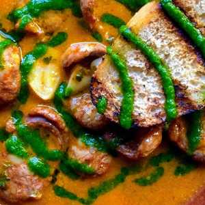 bread over soup and what looks like shrimp