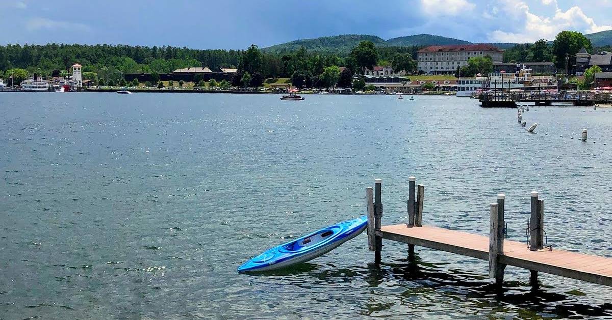 blue kayak at a dock on lake george