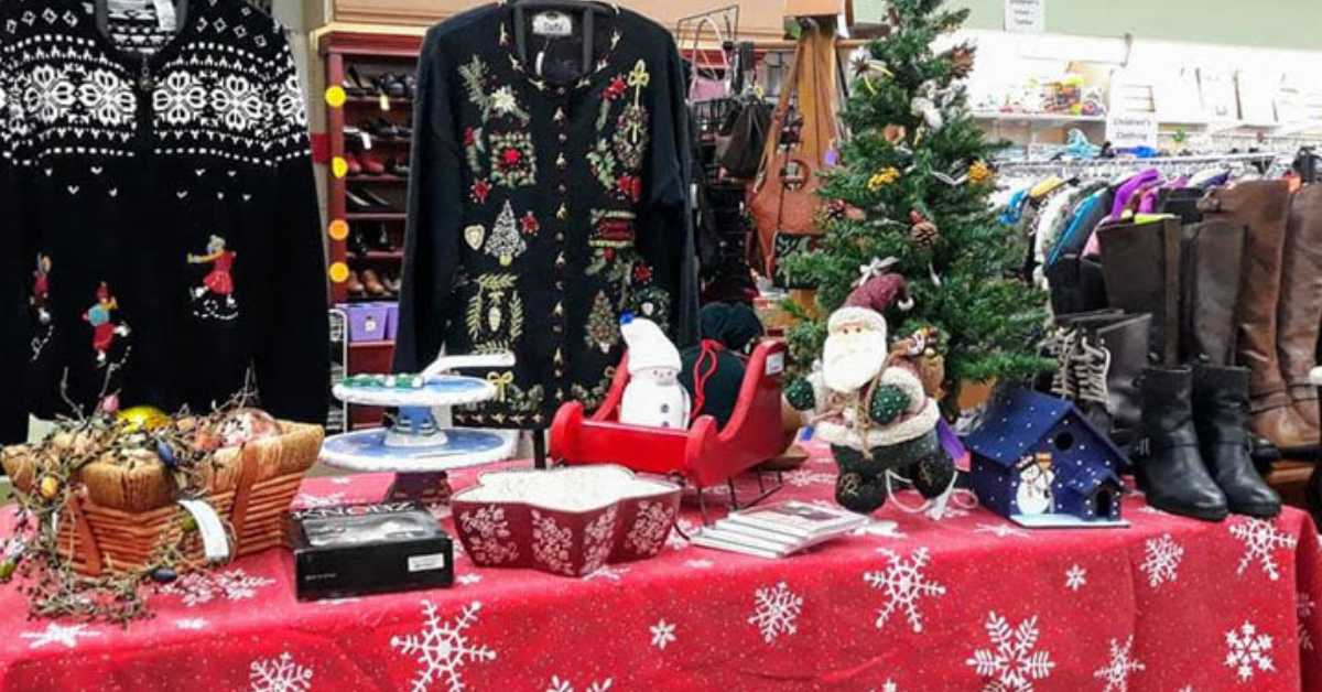 holiday items, sweaters, and boots on display in a shop