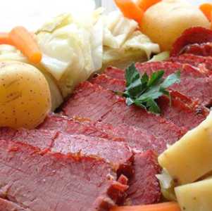a corned beef dinner, potatoes, and carrots