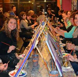 women at a paint and sip class