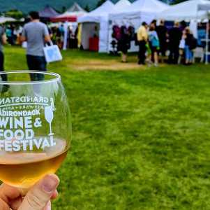 wine glass held up at festival