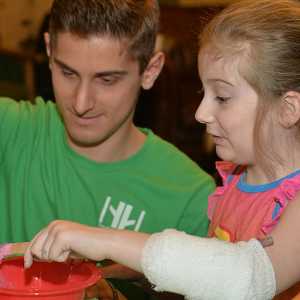 adult and child doing a craft