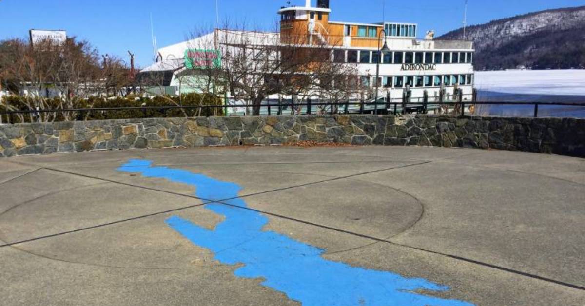 blue lake image on cement area with steamboat in background