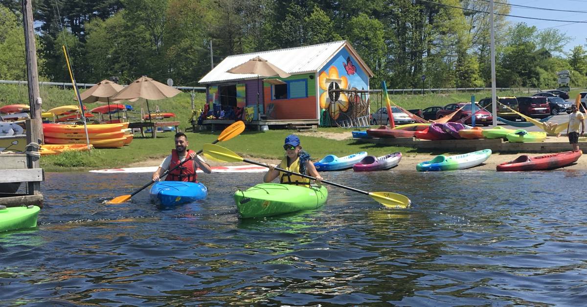 two people kayaking on a lake