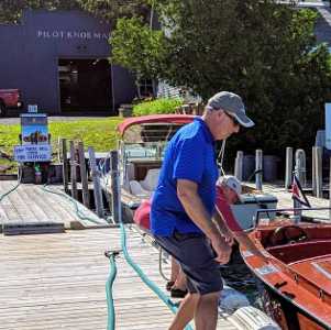 marina staff about to refuel a boat