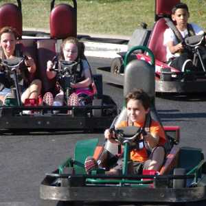 people riding in go karts