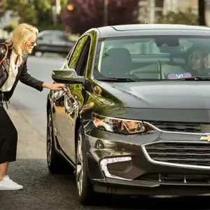 woman catching a lyft ride