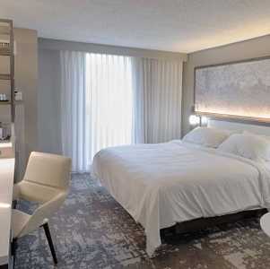 hotel room with bed and a desk