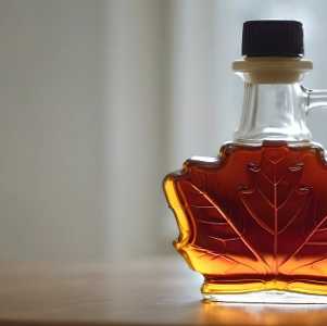 a leaf shaped bottle of maple syrup