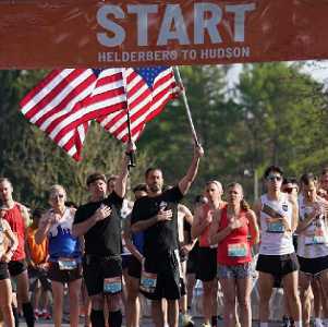 people standing at start line of a race