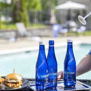 chicken sandwiches and saratoga water by pool