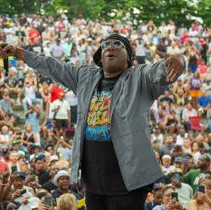 performer on stage at outdoor concert
