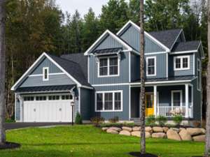 large blue house with a garage