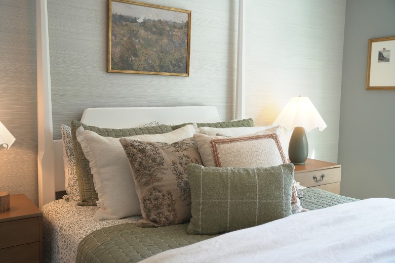 bedroom with bed and a lot of pillows