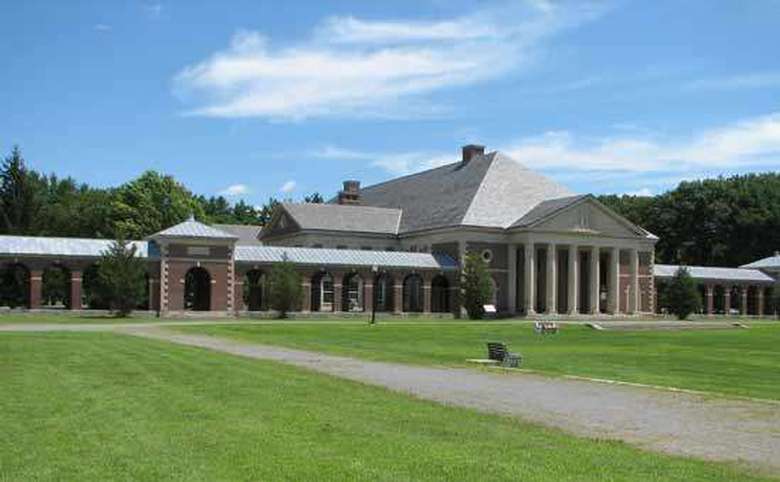 exterior of the hall of springs in saratoga spa state park with large columns in the front