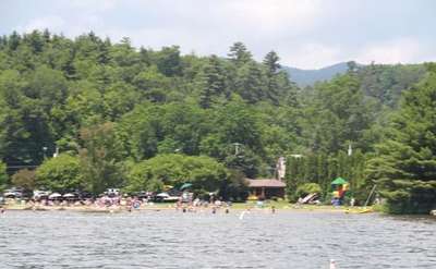 View from the water of people swimming and relaxing at Hague Town Beach