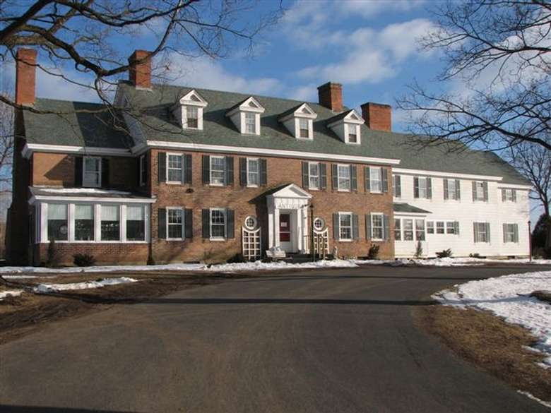 exterior of glenwood manor with blue sky in the background