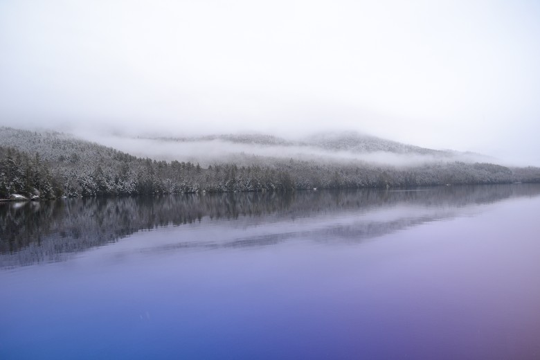 fog over a lake during winter