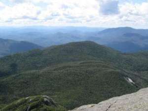 several mountain summits in the distance as seen from another mountain