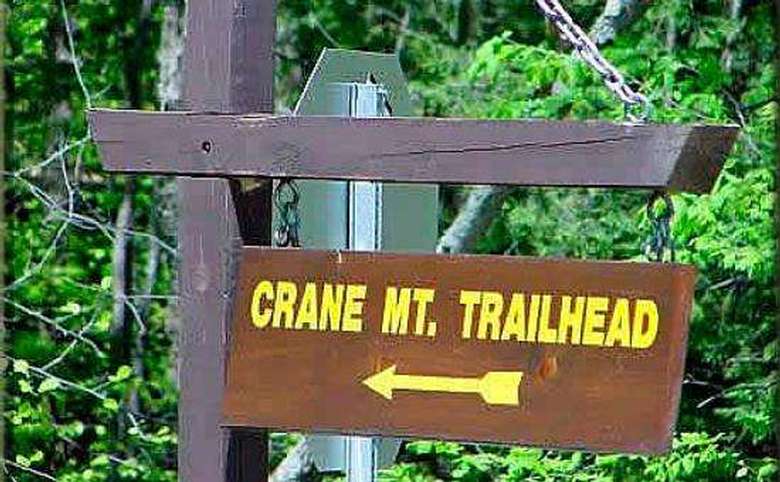 sign pointing to the crane mountain trailhead