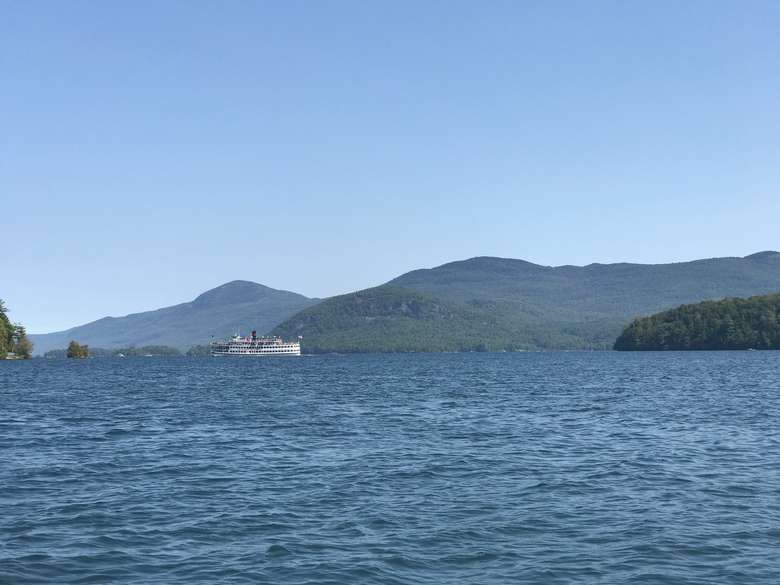 view of shelving rock from the middle of lake george