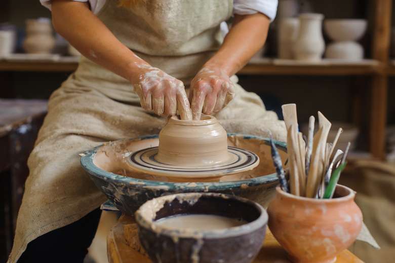 wheel throwing in a clay class