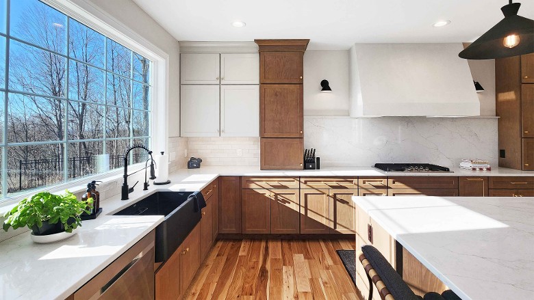 a large kitchen with window to the side