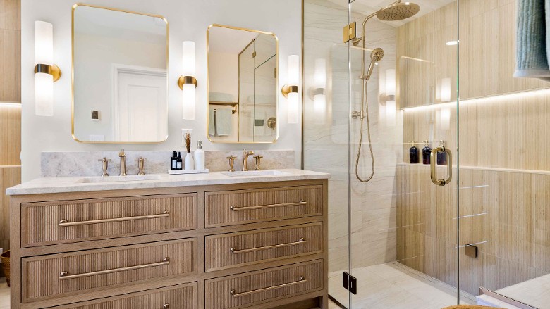 a modern bathroom with two sinks, two mirrors, and a glass shower