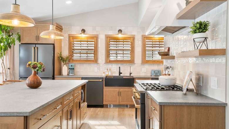 a modern kitchen with multiple windows above the sink area