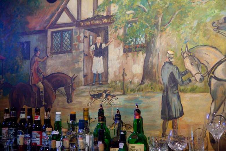painted mural behind the bar