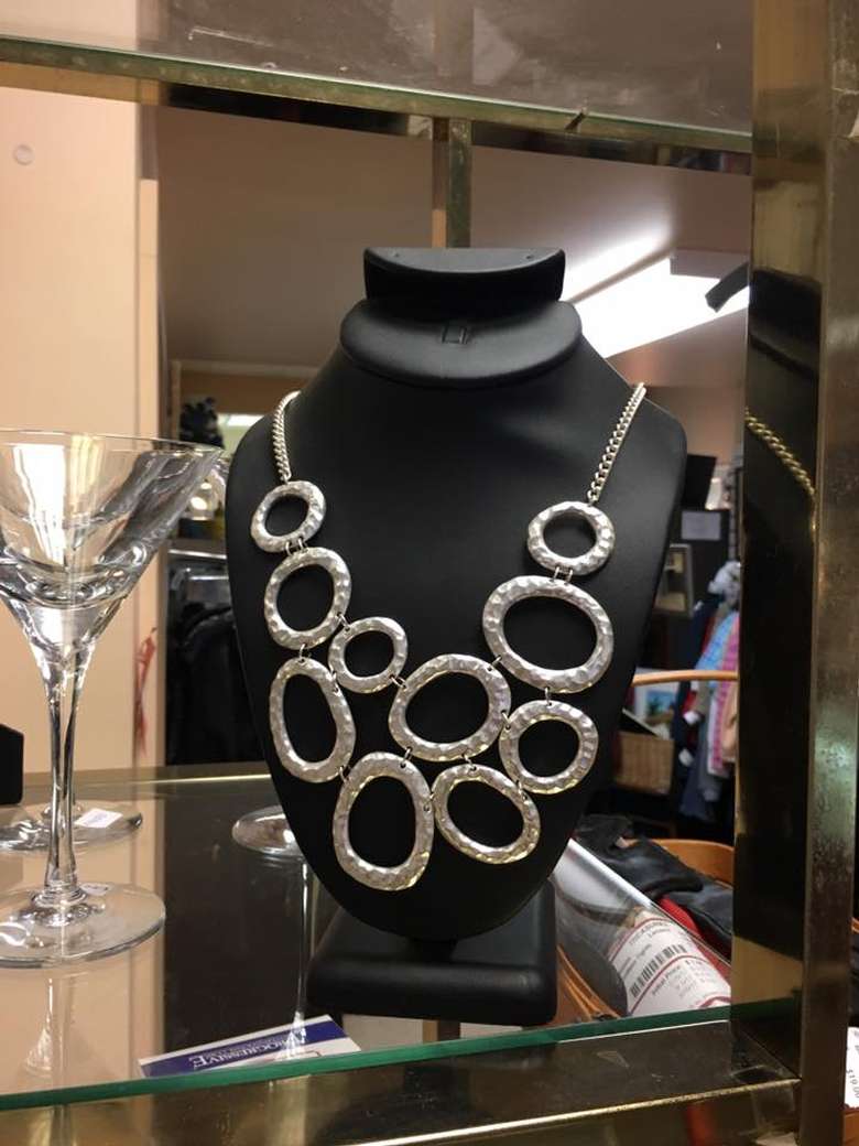 mannequin wearing a statement necklace