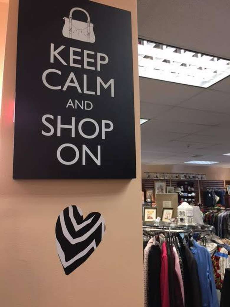 sign in a shop that says keep calm and shop on