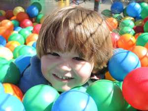 boy in colorful ball pit