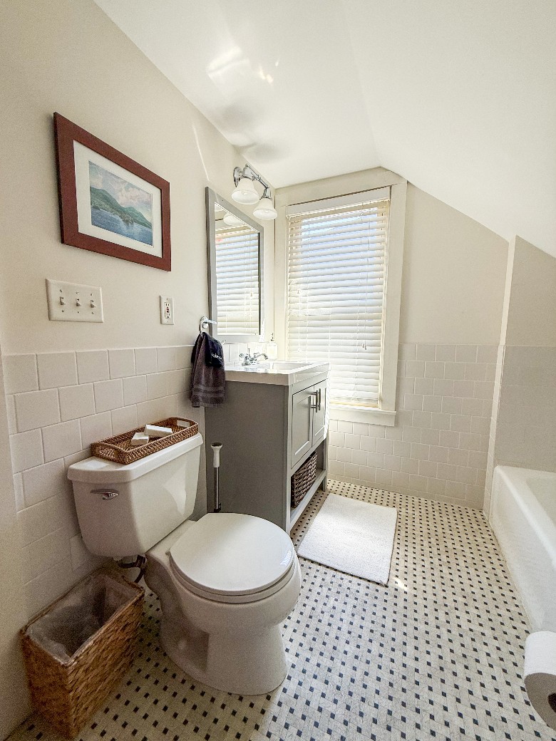 Second floor full bathroom with tub, and shower.