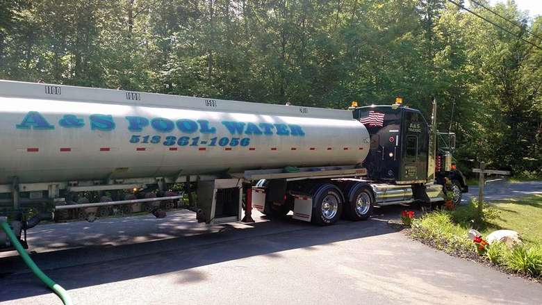 Pool truck at the end of a driveway