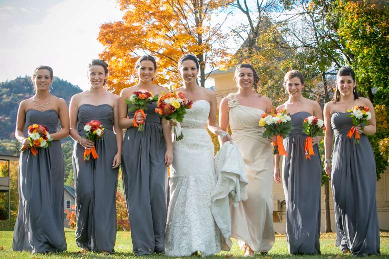 Bride and bridesmaids amongst fall foliage